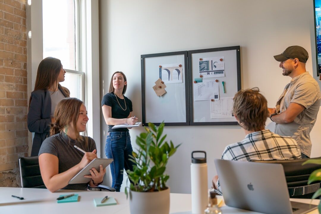 Editorial team meeting in a modern newsroom office